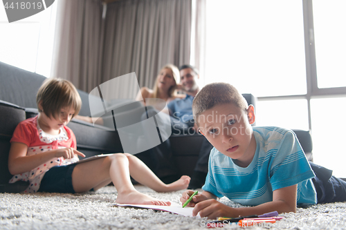 Image of young couple spending time with kids