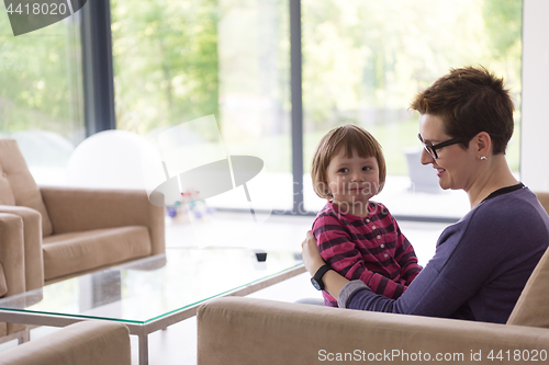 Image of mother and cute little girl enjoying their free time