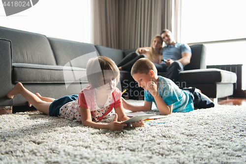 Image of young couple spending time with kids