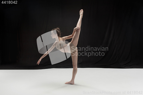 Image of Young teen dancer on white floor background.