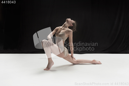 Image of Young teen dancer on white floor background.