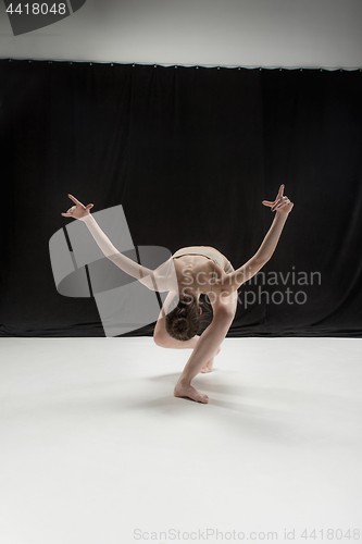 Image of Young teen dancer on white floor background.