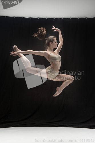 Image of Young teen dancer on white floor background.
