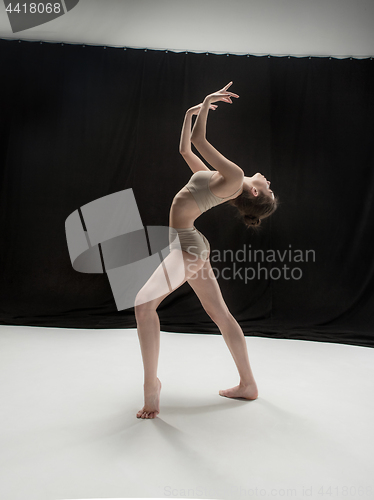 Image of Young teen dancer on white floor background.