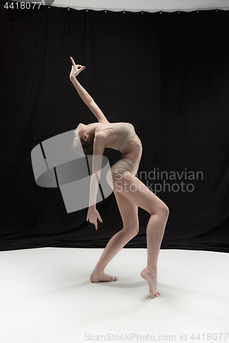 Image of Young teen dancer on white floor background.