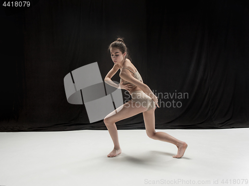 Image of Young teen dancer on white floor background.