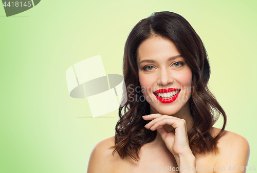 Image of beautiful smiling young woman with red lipstick