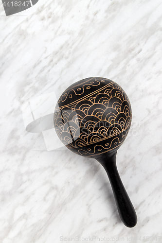 Image of Maracas percussion instrument on marble background