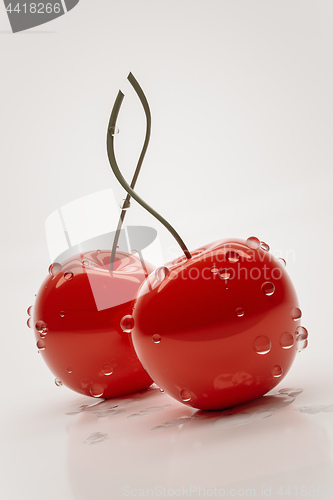 Image of two red cherries with water drops