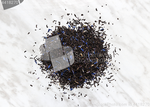 Image of Black Earl gray tea leaves on marble background