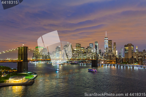 Image of Brooklyn Bridge and Lower Manhattan skyline at night, New York city, USA.