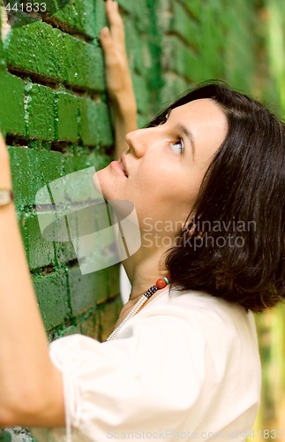 Image of Woman and green wall