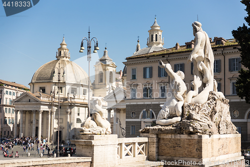 Image of Sculptures and churches on Piazza del Popolo in Rome, Italy.