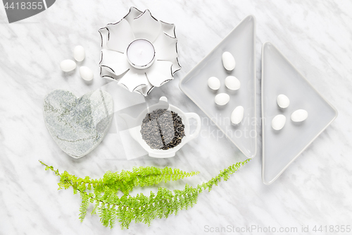 Image of Green tea leaves, white chocolate and home decor styling