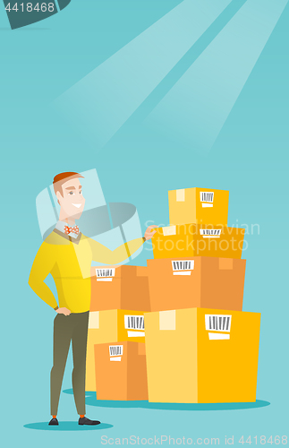 Image of Business man checking boxes in warehouse.