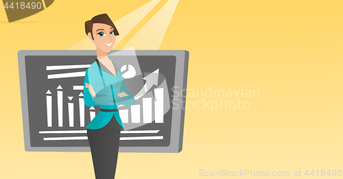 Image of Teacher or student standing in front of chalkboard