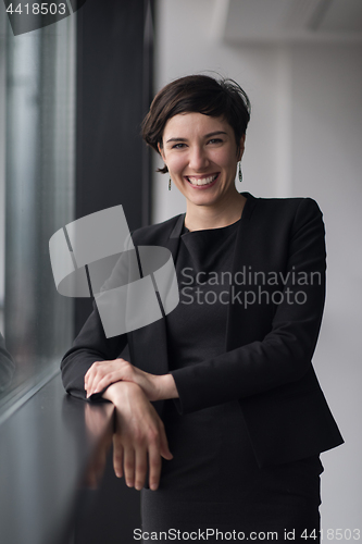 Image of Portrait of successful Businesswoman by the window