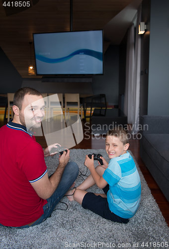 Image of Happy family playing a video game