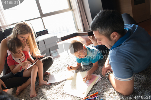 Image of young couple spending time with kids