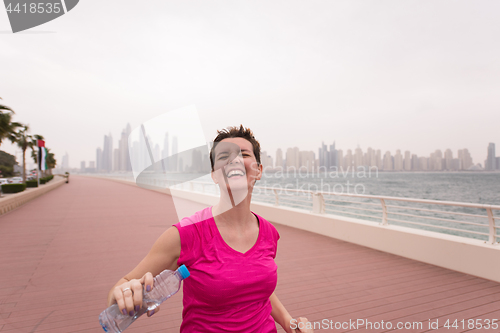 Image of young woman celebrating a successful training run