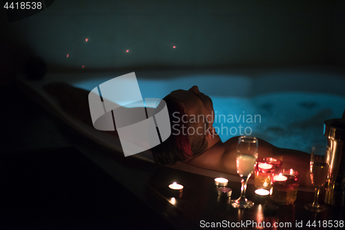 Image of man relaxing in the jacuzzi