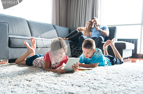 Image of young couple spending time with kids