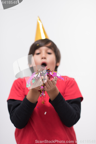 Image of kid blowing confetti