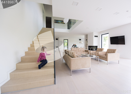 Image of family with little girl enjoys in the modern living room