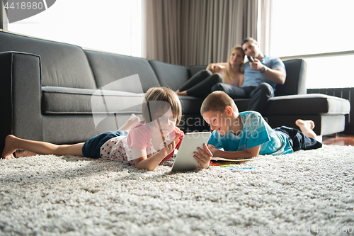 Image of young couple spending time with kids