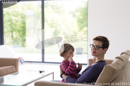 Image of mother and cute little girl enjoying their free time