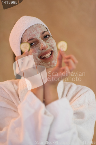 Image of Spa Woman applying Facial Mask