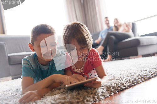 Image of couple spending time with kids