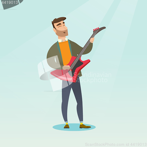 Image of Man playing the electric guitar.