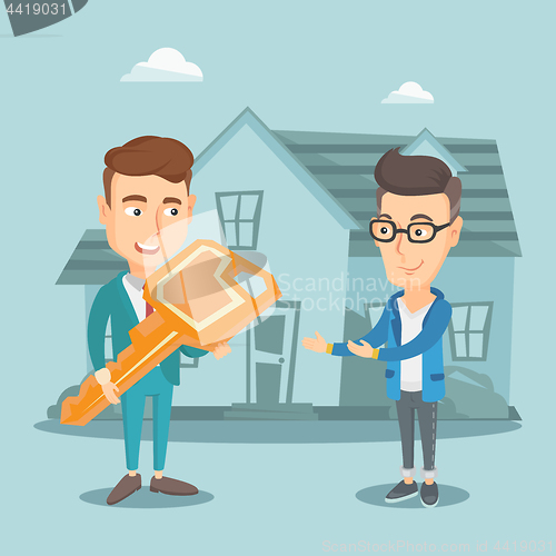 Image of Real estate agent giving key to new house owner.