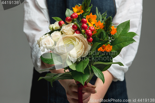 Image of Woman holding a gorgeous bouquet