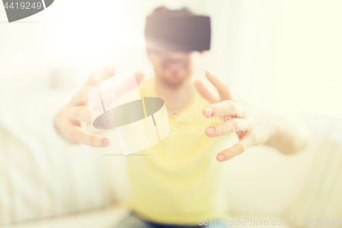 Image of young man in virtual reality headset or 3d glasses