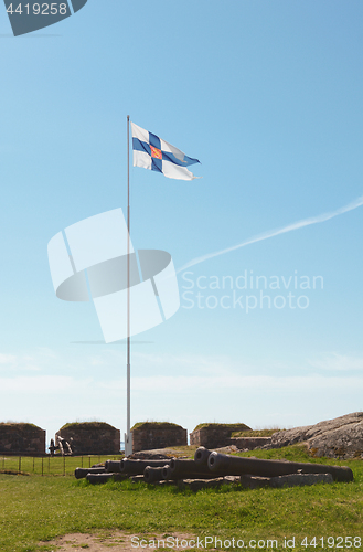 Image of Finland state flag flying high on Suomenlinna