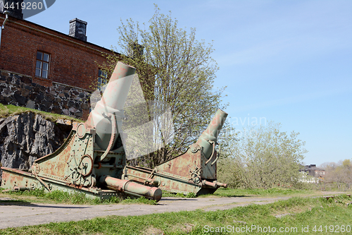 Image of Two rusted green cannons on Suomenlinna island, Finland