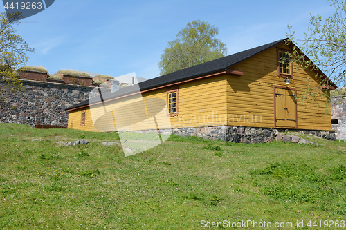 Image of Yellow wooden hut on Suomenlinna island