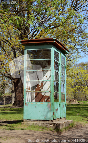 Image of Weathered and rusted disused phone booth