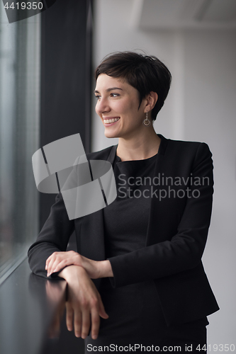 Image of Portrait of successful Businesswoman by the window