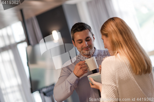 Image of A young couple is preparing for a job and using a laptop