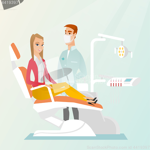 Image of Patient and doctor in the dentist office.