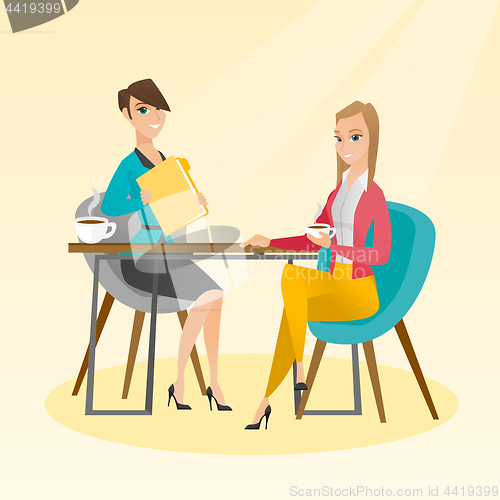 Image of Two businesswomen during business meeting.