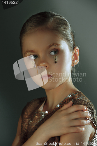 Image of The fashion portrait of young beautiful teen girl at studio