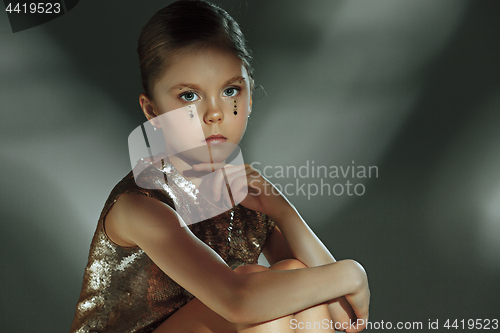 Image of The fashion portrait of young beautiful teen girl at studio