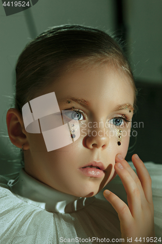 Image of The fashion portrait of young beautiful teen girl at studio