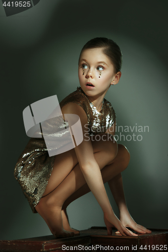 Image of The fashion portrait of young beautiful teen girl at studio