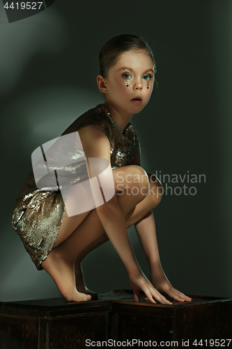 Image of The fashion portrait of young beautiful teen girl at studio