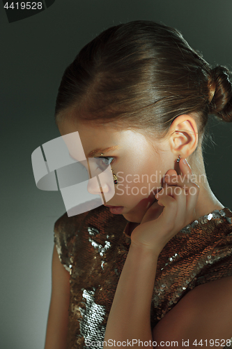 Image of The fashion portrait of young beautiful teen girl at studio
